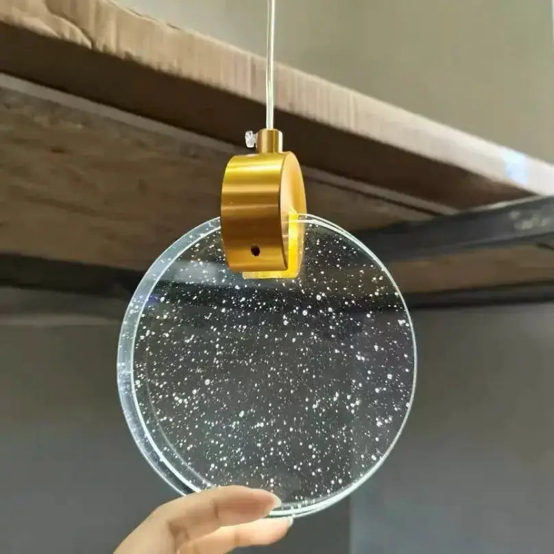 Decorbites gold LED crystal pendant light with round speckled glass disk and brass hanger on Tampa Home & Garden Store