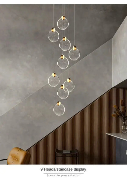Decorbites modern gold LED crystal pendant light with 9 clear glass discs and gold hardware on Tampa Home & Garden Store