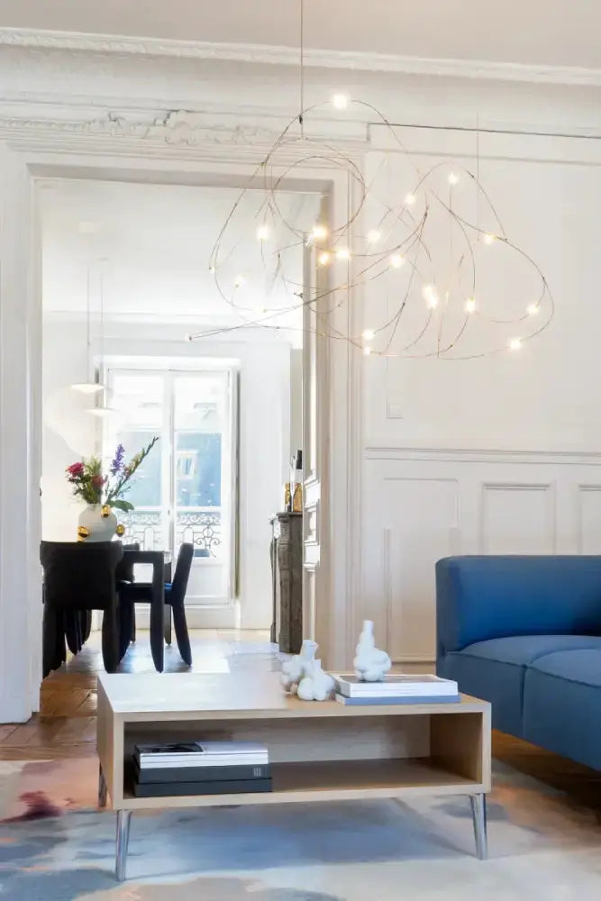 Chandelier Decorbites modern LED firefly with a gold wire frame and warm white LEDs on Tampa Home & Garden Store