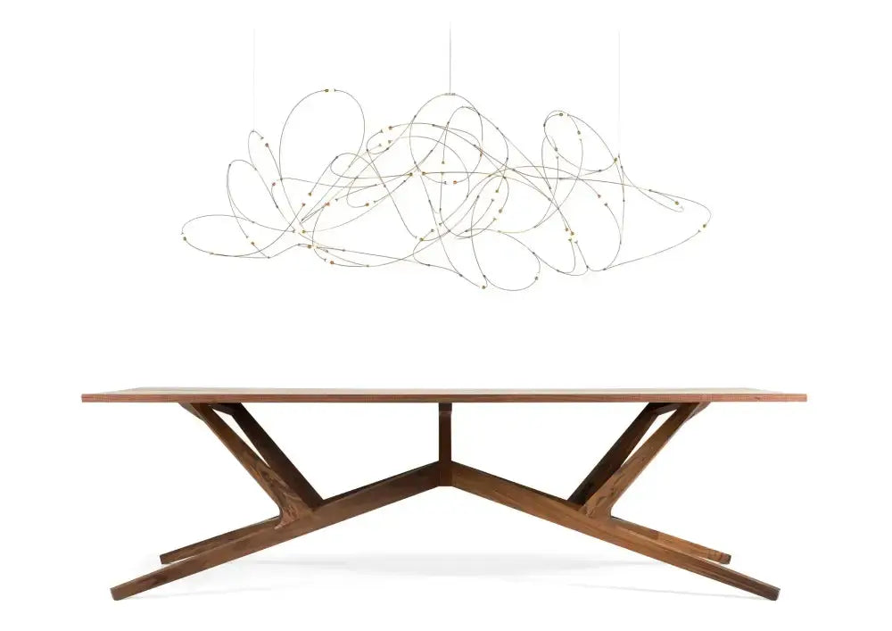 Chandelier Decorbites LED firefly chandelier with tangled wire design over a wooden dining table on Tampa Home & Garden Store