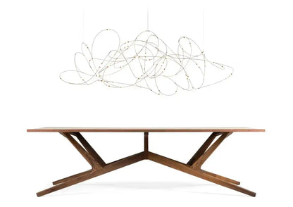 Chandelier Decorbites LED firefly chandelier with tangled wire design over a wooden dining table on Tampa Home & Garden Store