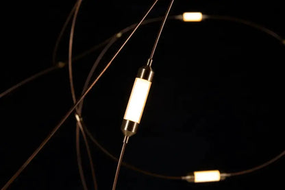 Chandelier Decorbites LED firefly light with warm white cylindrical bulbs on dark cords on Tampa Home & Garden Store