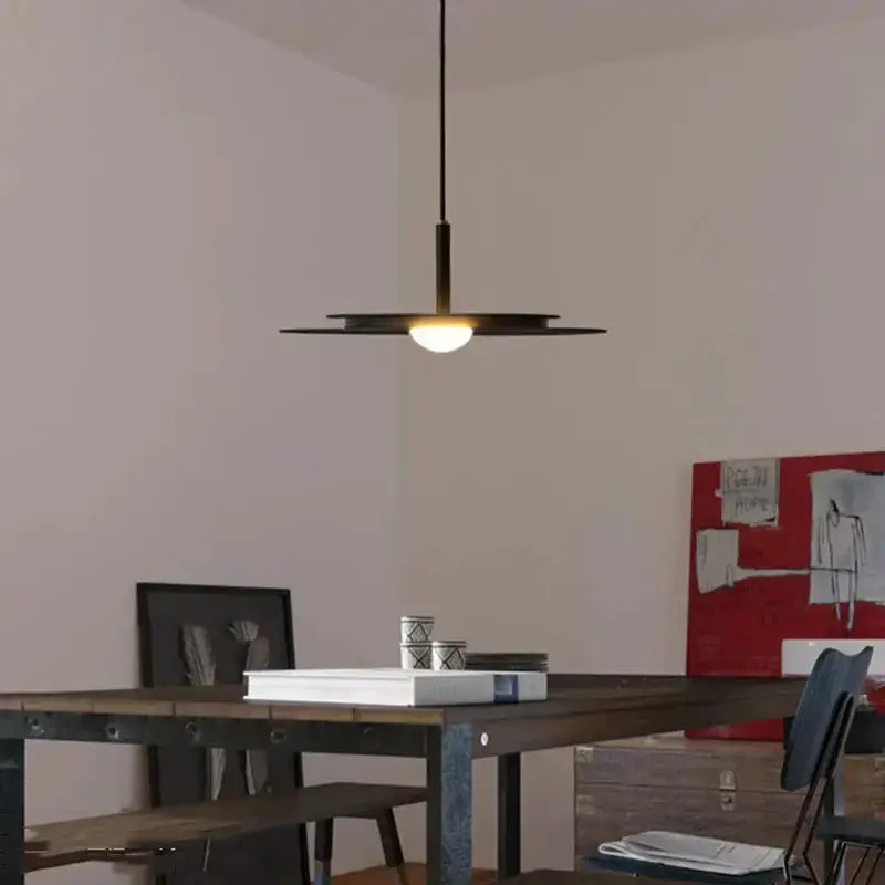 Decorbites minimalist black flying saucer pendant chandelier over dining table on Tampa Home & Garden Store