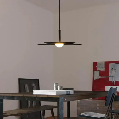 Decorbites minimalist black flying saucer pendant chandelier over dining table on Tampa Home & Garden Store