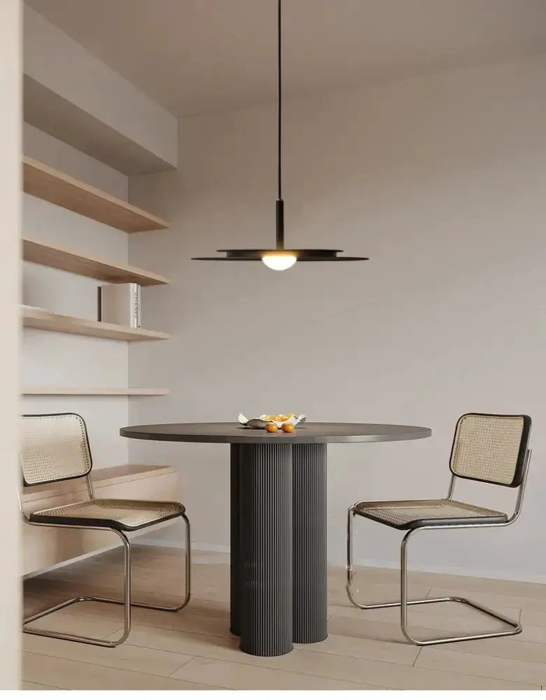 Minimalist black flying saucer chandelier pendant over round dining table Decorbites on Tampa Home & Garden Store