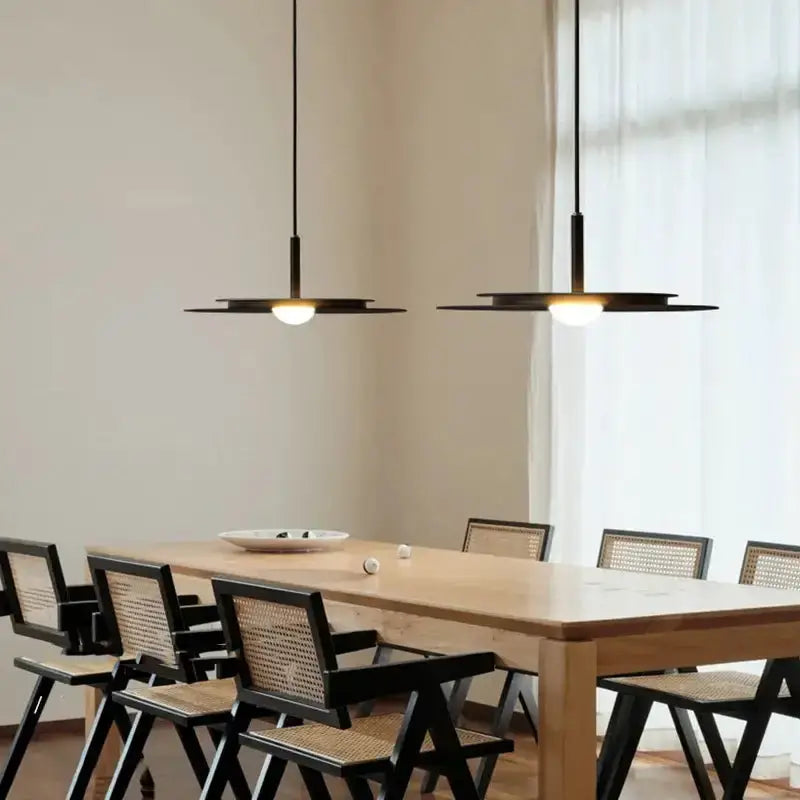 Decorbites minimalist black flying saucer pendant lights, pair over dining table on Tampa Home & Garden Store