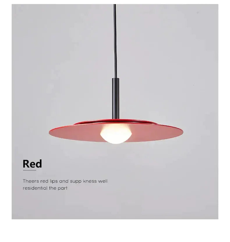 Red flying saucer pendant light with a black cord for dining room illumination on Tampa Home & Garden Store