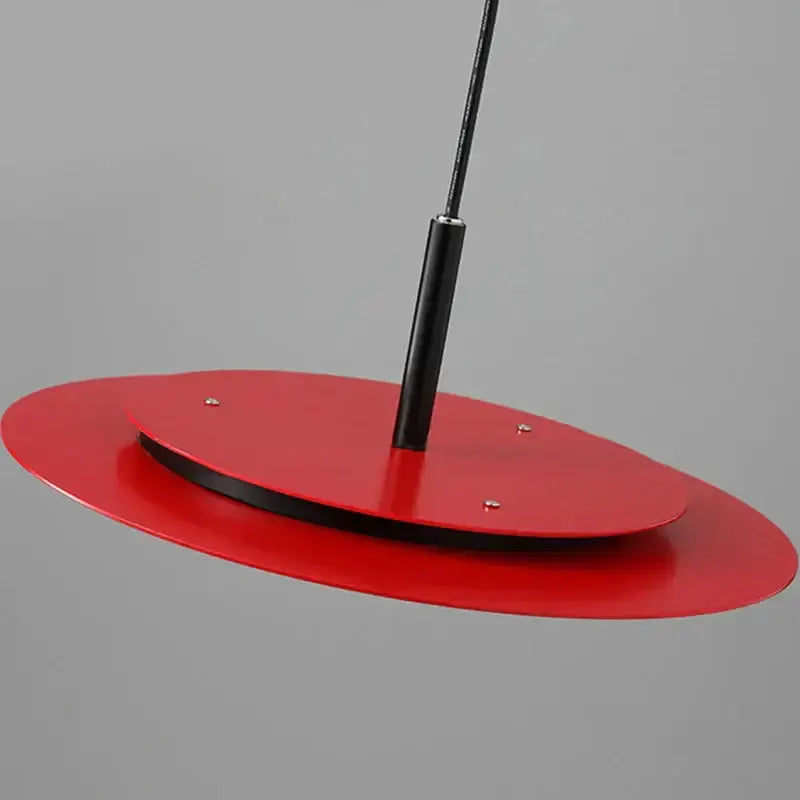 Minimalist red flying saucer pendant light by Decorbites with black hanging stem on Tampa Home & Garden Store