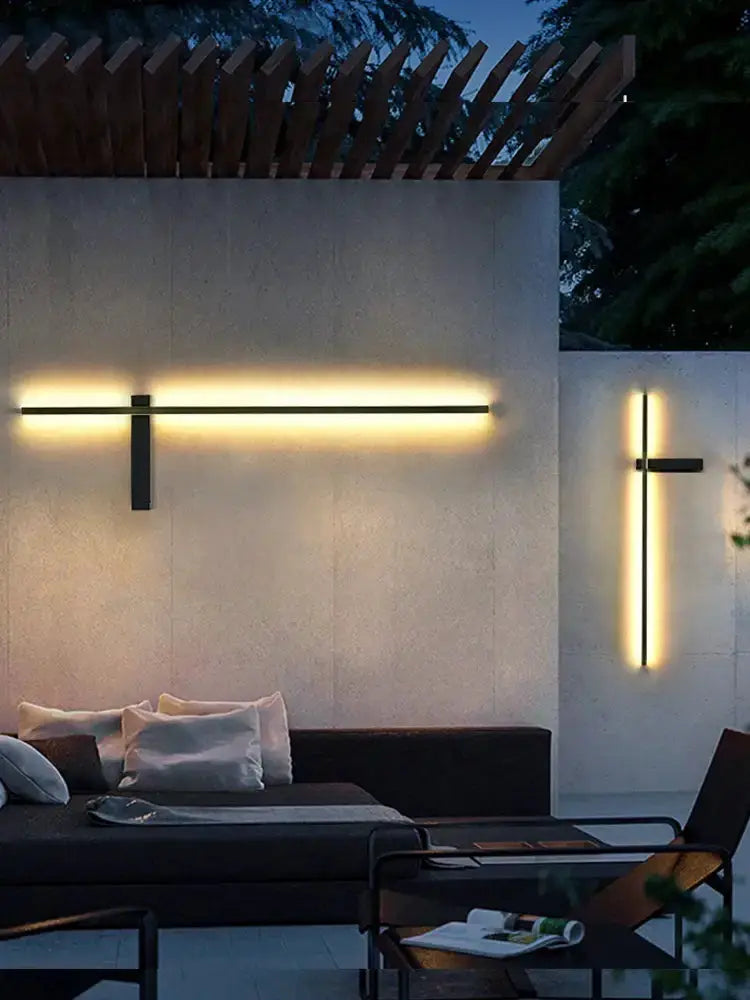Decorbites outdoor wall light sconce duo: long horizontal LED bar and vertical crossbar on wall on Tampa Home & Garden Store