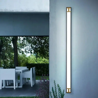 Modern black and gold LED outdoor wall lamp garden sconce by Decorbites on blue wall on Tampa Home & Garden Store