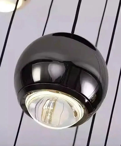 Decorbites globe pendant light in black and gold, round modern dining fixture on Tampa Home & Garden Store