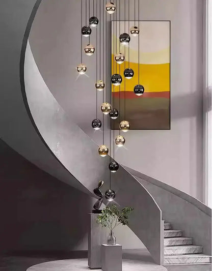 Decorbites black and gold globe pendant chandelier with multiple hanging spheres on Tampa Home & Garden Store