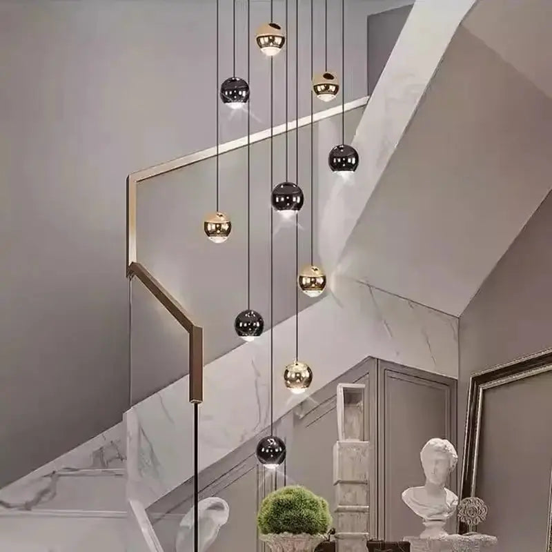 Modern black and gold globe pendant chandelier with multiple hanging heads for dining room on Tampa Home & Garden Store