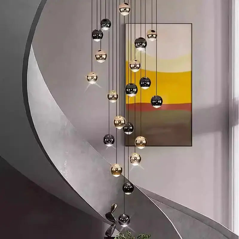 Decorbites globe pendant chandelier in black and gold with multiple hanging spheres on Tampa Home & Garden Store
