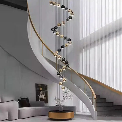 Modern black & gold globe pendant chandelier with multiple heads spiraling along a staircase on Tampa Home & Garden Store