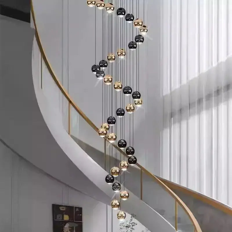Modern black and gold globe pendant chandelier with multiple heads in a spiral layout on Tampa Home & Garden Store