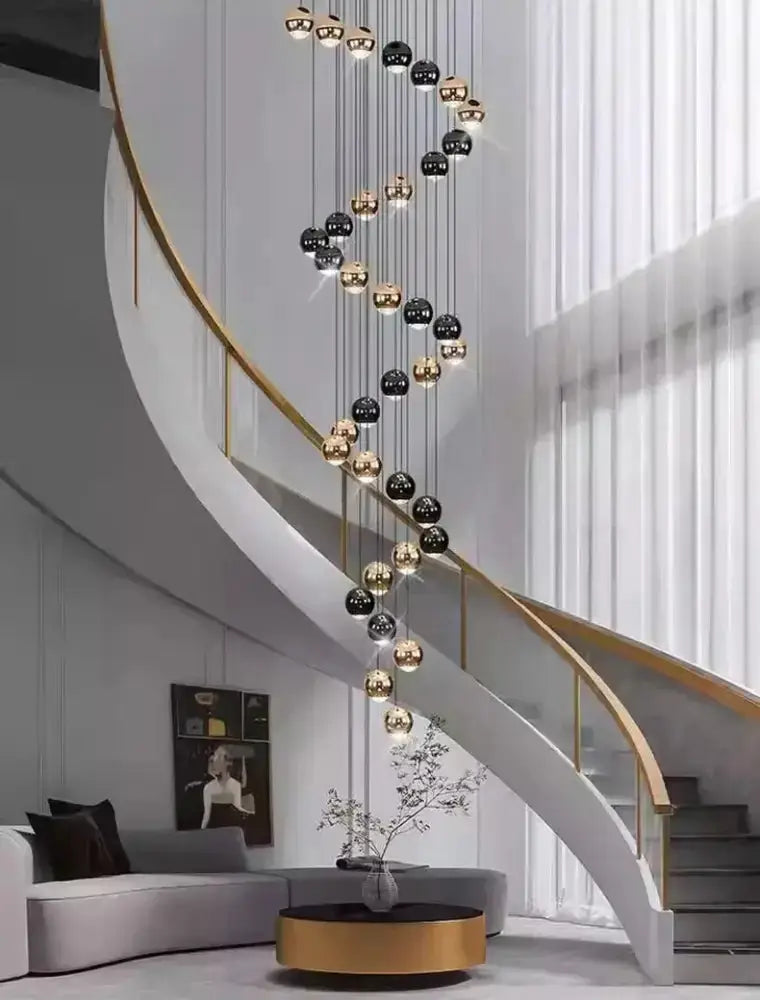 Modern black and gold globe pendant chandelier with multiple heads along staircase Decorbites on Tampa Home & Garden Store