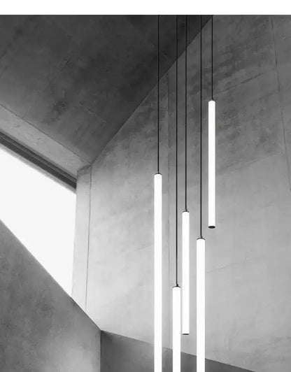 Chandelier: modern black LED pendant with tall cylindrical tubes hanging at varying heights on Tampa Home & Garden Store