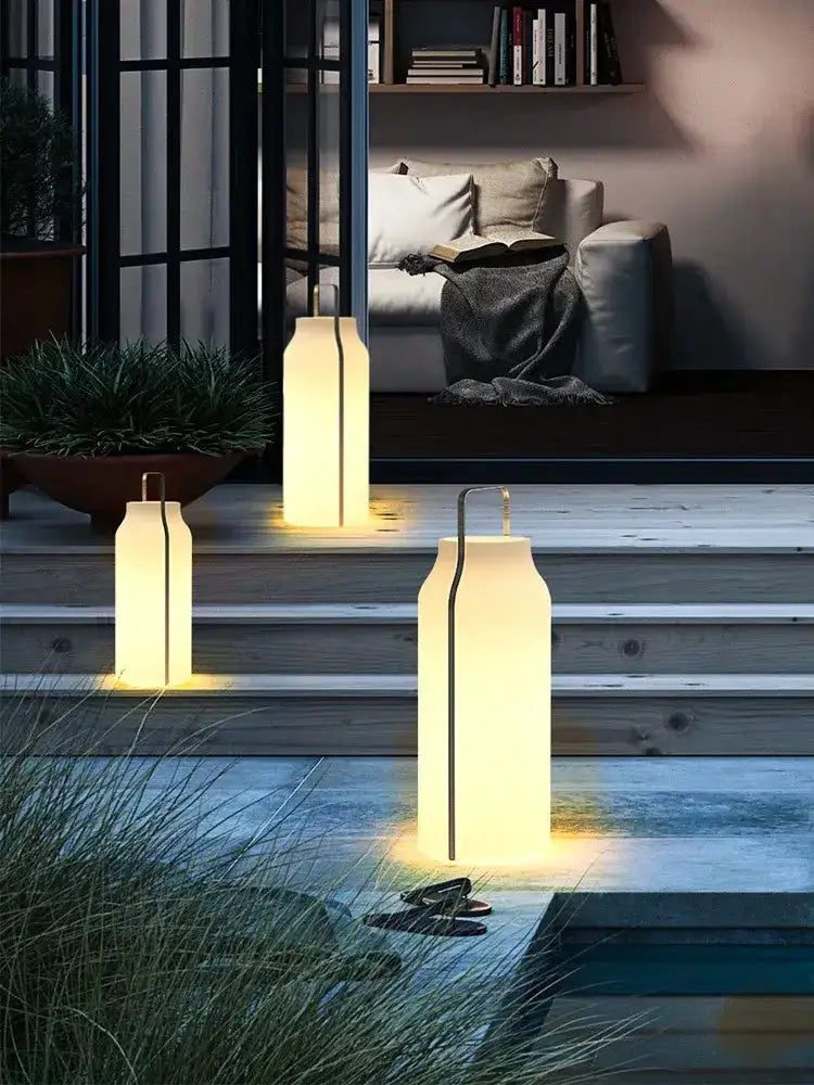 Minimalist stainless steel LED lanterns Decorbites, set of 3 with warm white glow on steps on Tampa Home & Garden Store