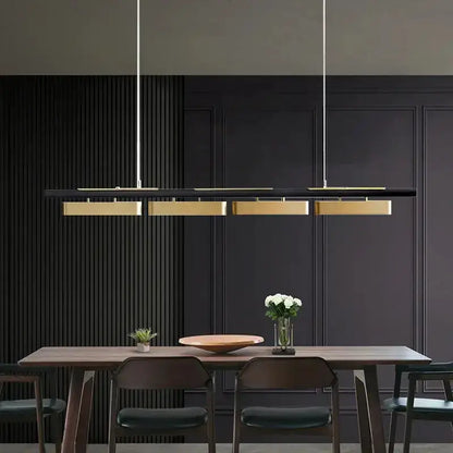 Chandelier by Decorbites: black and gold strip LED pendant lights over dark wood dining table on Tampa Home & Garden Store