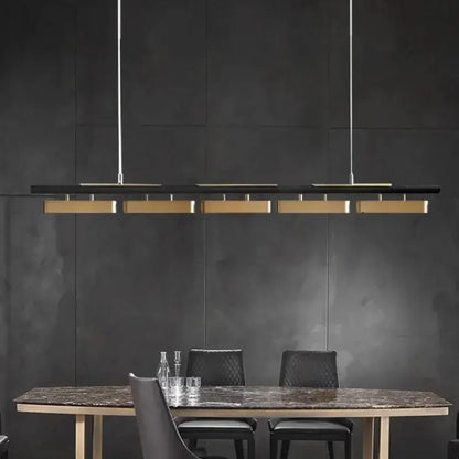 Chandelier: Decorbites black and gold strip LED pendant lights over marble dining table on Tampa Home & Garden Store