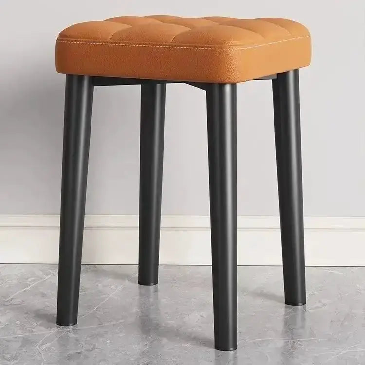 Decorbites modern low square dining stool with orange upholstered seat and black metal legs on Tampa Home & Garden Store