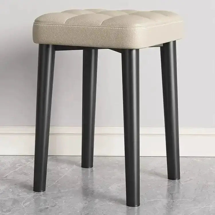 Decorbites modern low square stool with tufted beige upholstered seat and black legs on Tampa Home & Garden Store