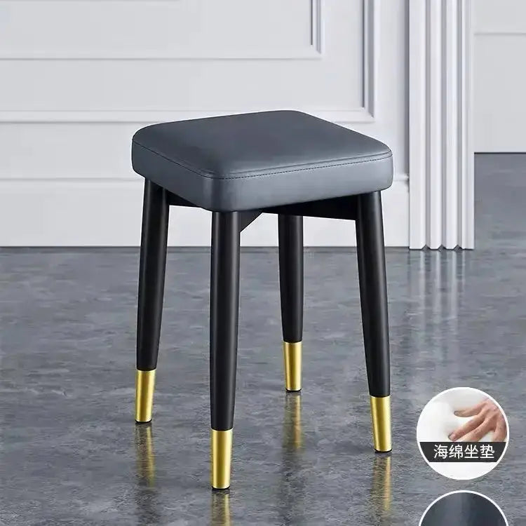 Modern low square stool bench with gray upholstered seat, black legs and gold-tipped feet Decorbites on Tampa Home & Garden Store