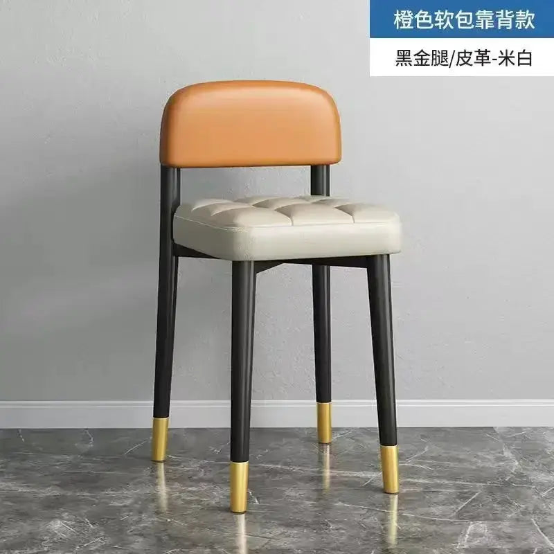 Modern low square dining stool with orange backrest and cream seat, black legs with gold tips on Tampa Home & Garden Store