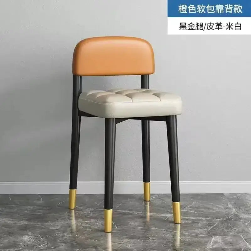 Decorbites modern low square dining stool with orange backrest and tufted beige seat, black legs with gold caps on Tampa Home & Garden Store