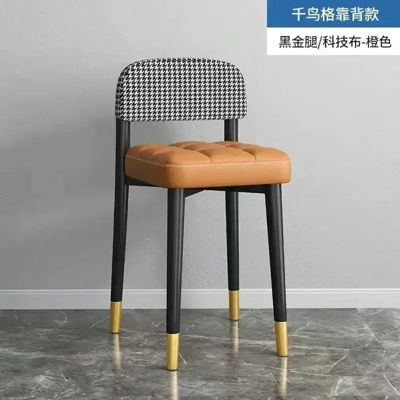 Decorbites modern low square dining stool with tufted tan seat and black legs with gold tips on Tampa Home & Garden Store