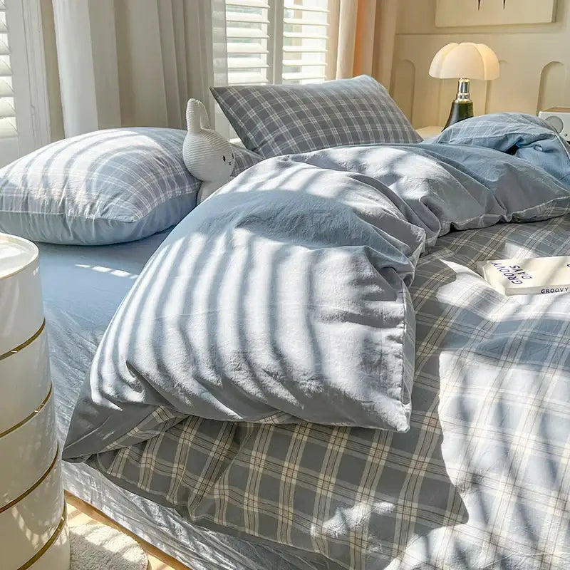 Decorbites Blue Plaid Duvet Set on bed with light blue duvet and plaid pillow shams on Tampa Home & Garden Store