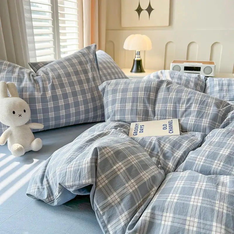 Blue plaid duvet set by Decorbites with 2 matching pillow shams on a bed on Tampa Home & Garden Store