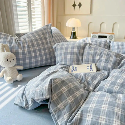 Blue plaid duvet set by Decorbites with 2 matching pillow shams on a bed on Tampa Home & Garden Store