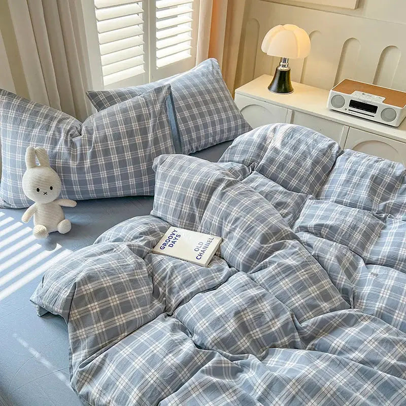 Blue Plaid Duvet Set by Decorbites with matching plaid pillow shams on bed on Tampa Home & Garden Store