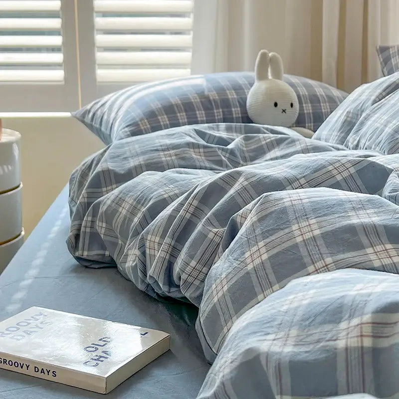 Blue Plaid Duvet Set by Decorbites with matching pillowcases on a cozy bed on Tampa Home & Garden Store
