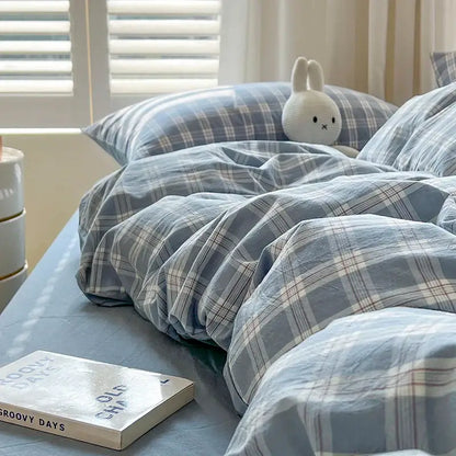 Blue Plaid Duvet Set by Decorbites with matching pillowcases on a cozy bed on Tampa Home & Garden Store
