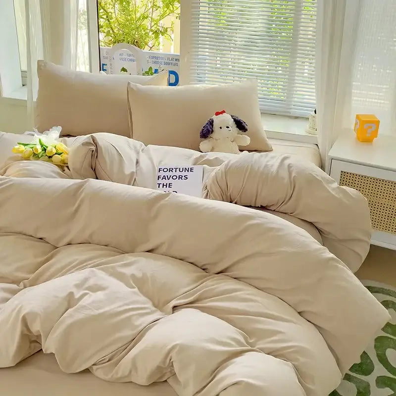 Luxurious cream cotton duvet cover set by Decorbites on bed with beige pillows on Tampa Home & Garden Store