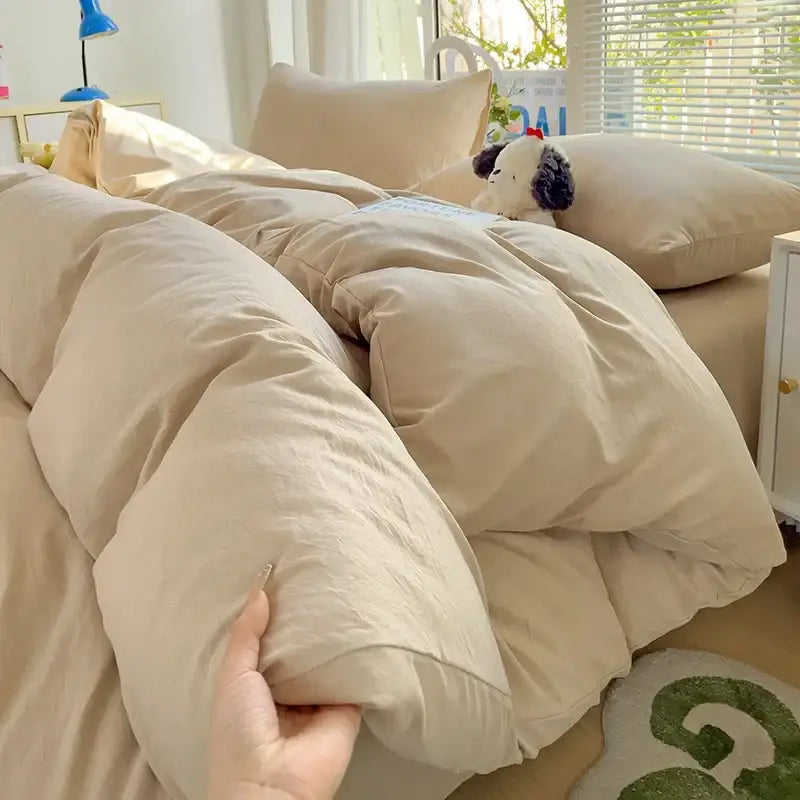 Decorbites cream cotton duvet cover set on a bed with beige pillows and a plush comforter on Tampa Home & Garden Store