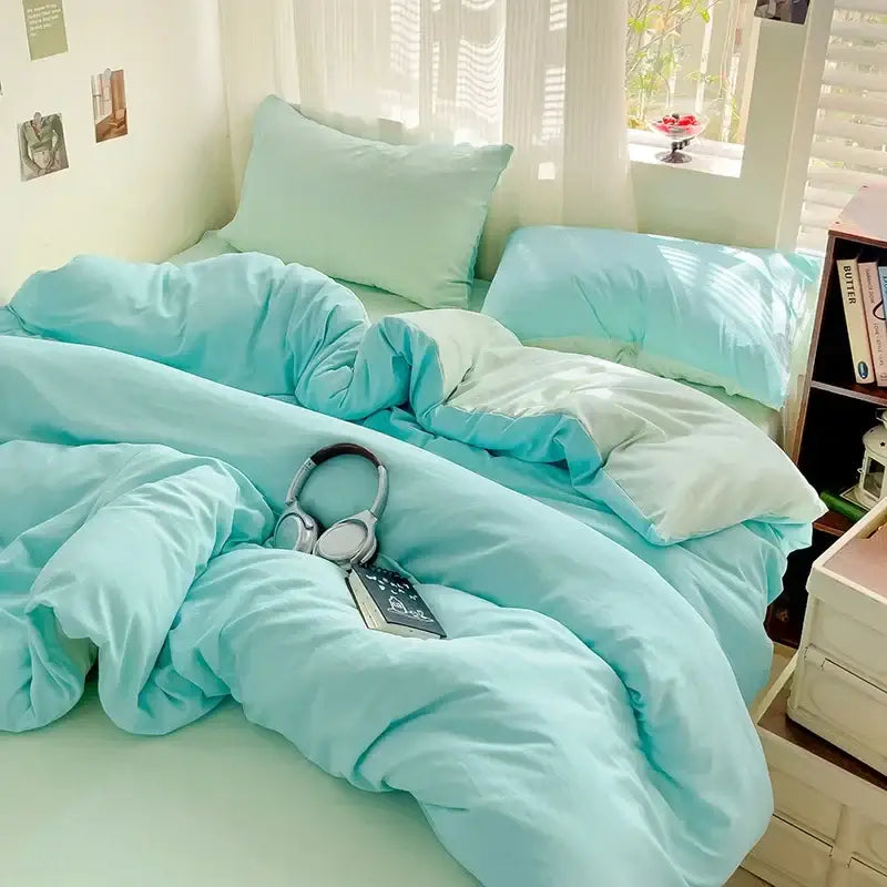 Luxurious cream cotton bedding set duvet cover by Decorbites with turquoise pillows on a bed on Tampa Home & Garden Store