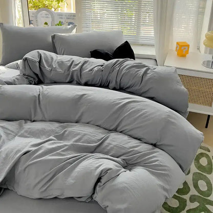Decorbites light grey cotton duvet cover set with plush comforter on bed in bright bedroom on Tampa Home & Garden Store