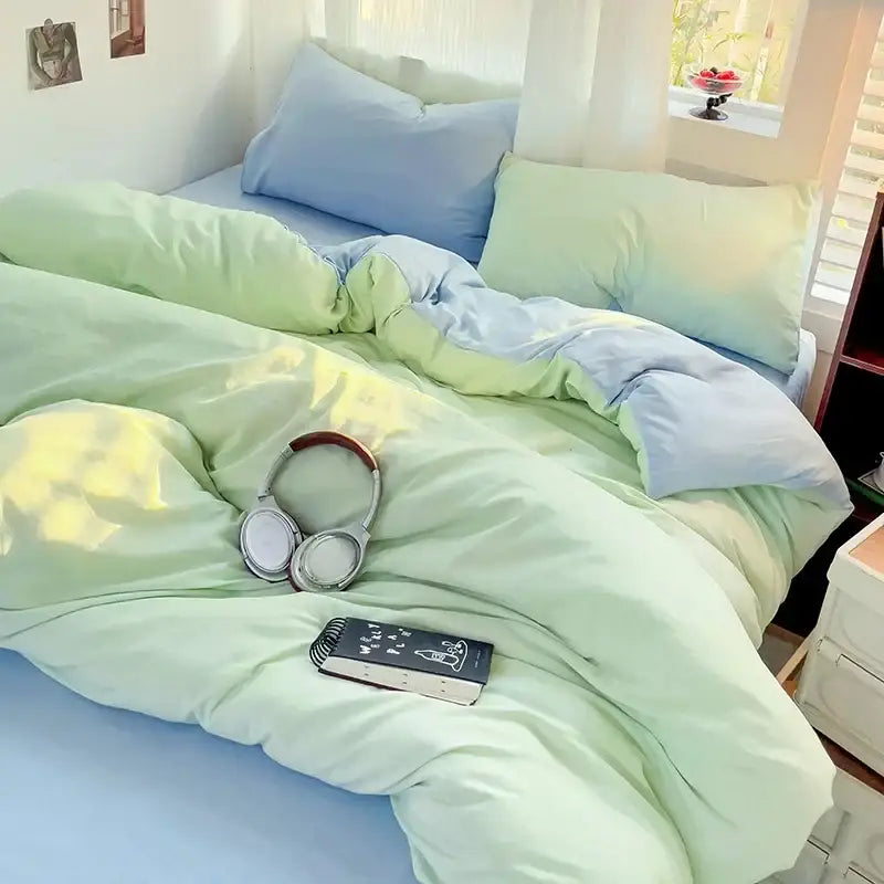 Luxurious cream cotton duvet cover bedding set on pastel green and blue bed with pillows on Tampa Home & Garden Store