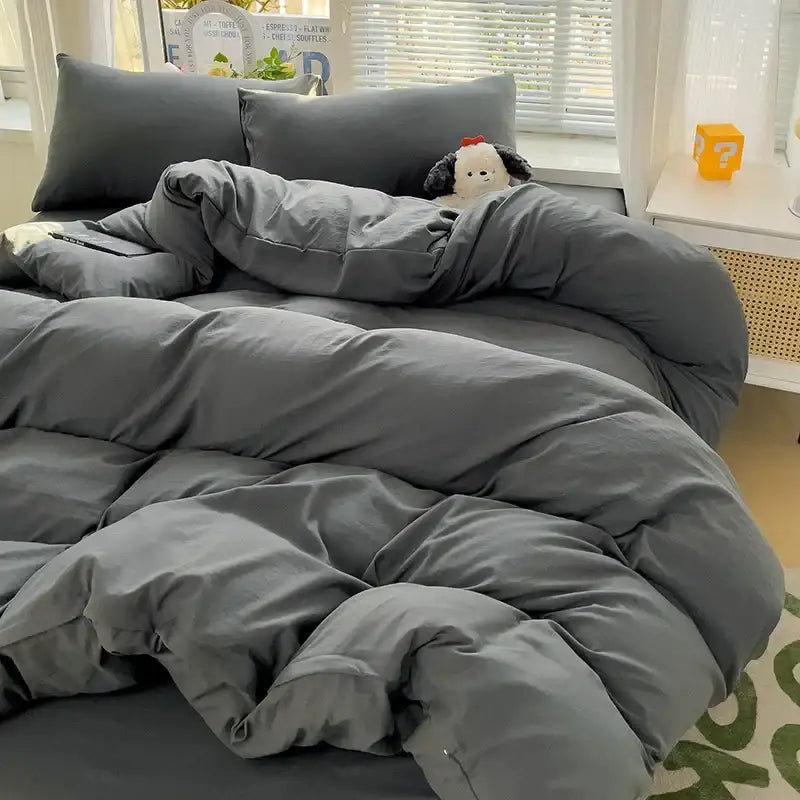 Decorbites gray cotton duvet cover set on bed with a quilted comforter and pillowcases on Tampa Home & Garden Store