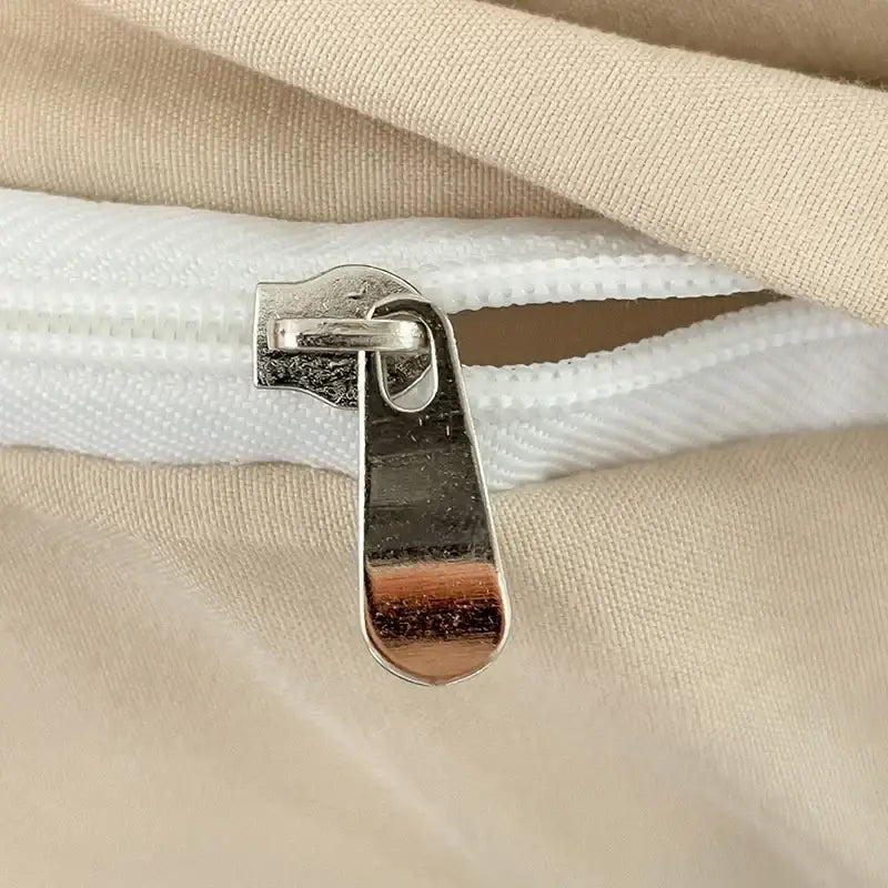 Cream cotton duvet cover by Decorbites with metal zipper closeup on Tampa Home & Garden Store