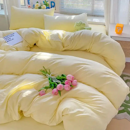 Decorbites cream cotton duvet cover set on a fluffy yellow bed with matching pillows on Tampa Home & Garden Store