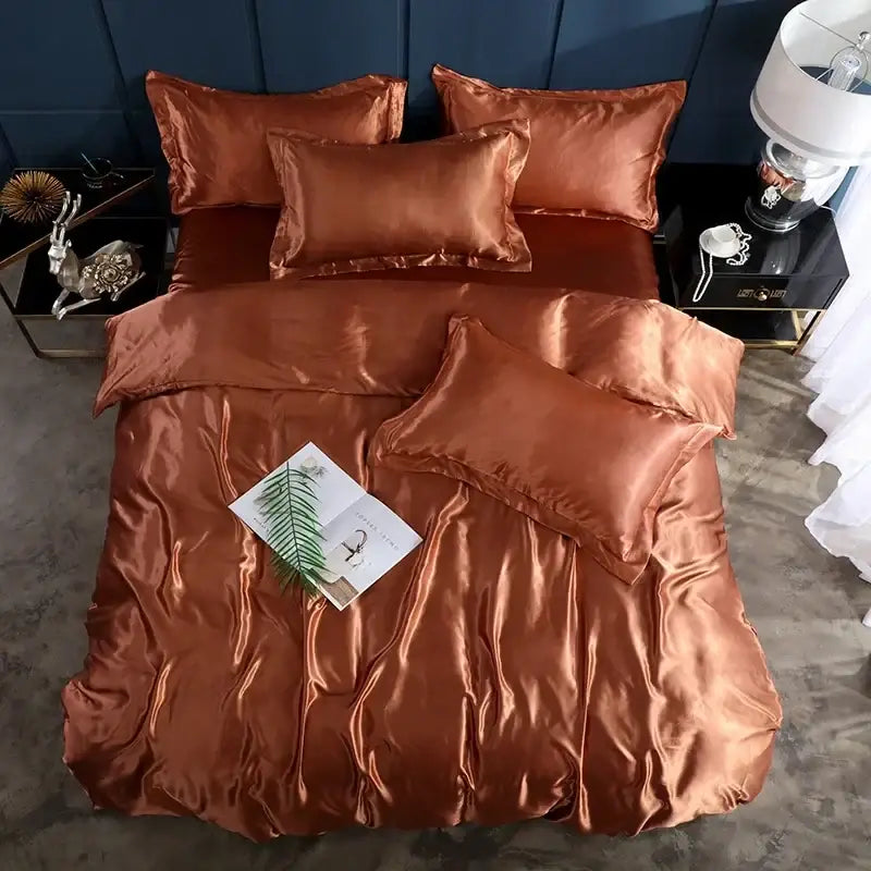 Copper satin duvet cover with matching pillow shams on a bed with a blue headboard on Tampa Home & Garden Store