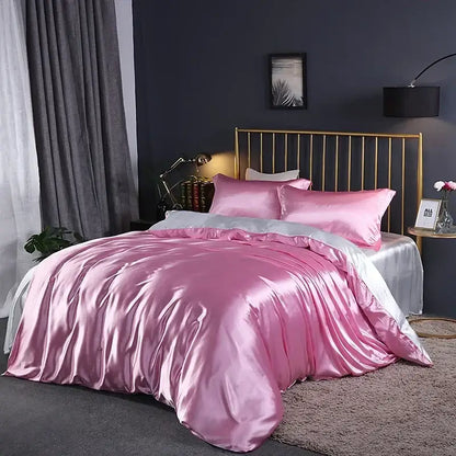 Pink satin duvet set by Decorbites on bed with gold metal headboard on Tampa Home & Garden Store