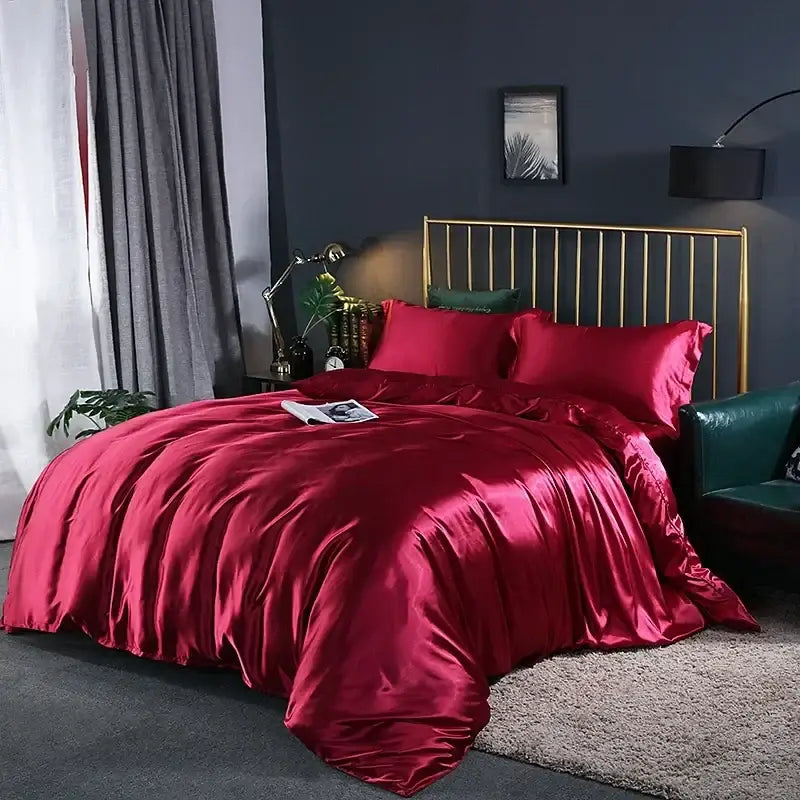 Metallic Gray Satin Duvet Set by Decorbites on bed with vivid red satin coverlets in a modern bedroom on Tampa Home & Garden Store