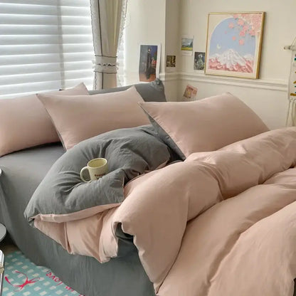 Duvet cover bedding set by Decorbites in pink and gray with matching pillows on bed on Tampa Home & Garden Store