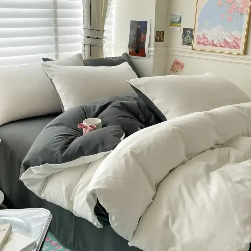 Luxurious white and dark gray duvet cover bedding set on a bed with white pillows on Tampa Home & Garden Store